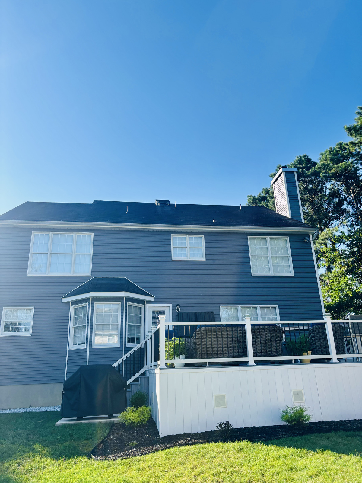 Finished roof replacement on the back of a shore home